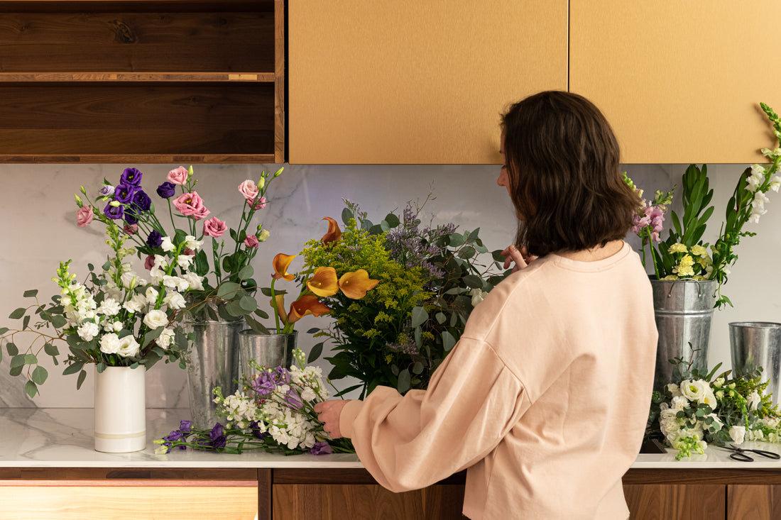 Woman treating her flowers